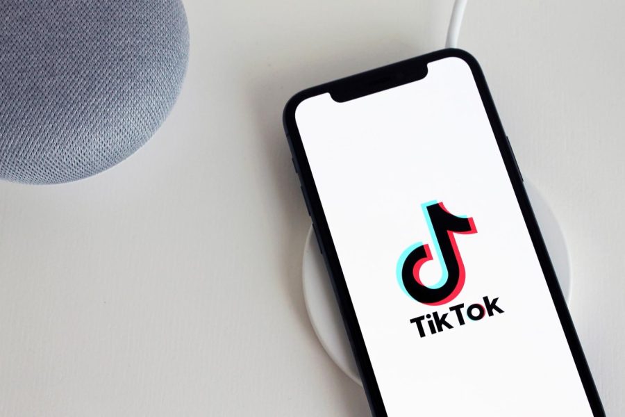 (An image of a phone with TikTok being opened, found on https://www.plannthat.com/how-to-use-tiktok-analytics-tool/)